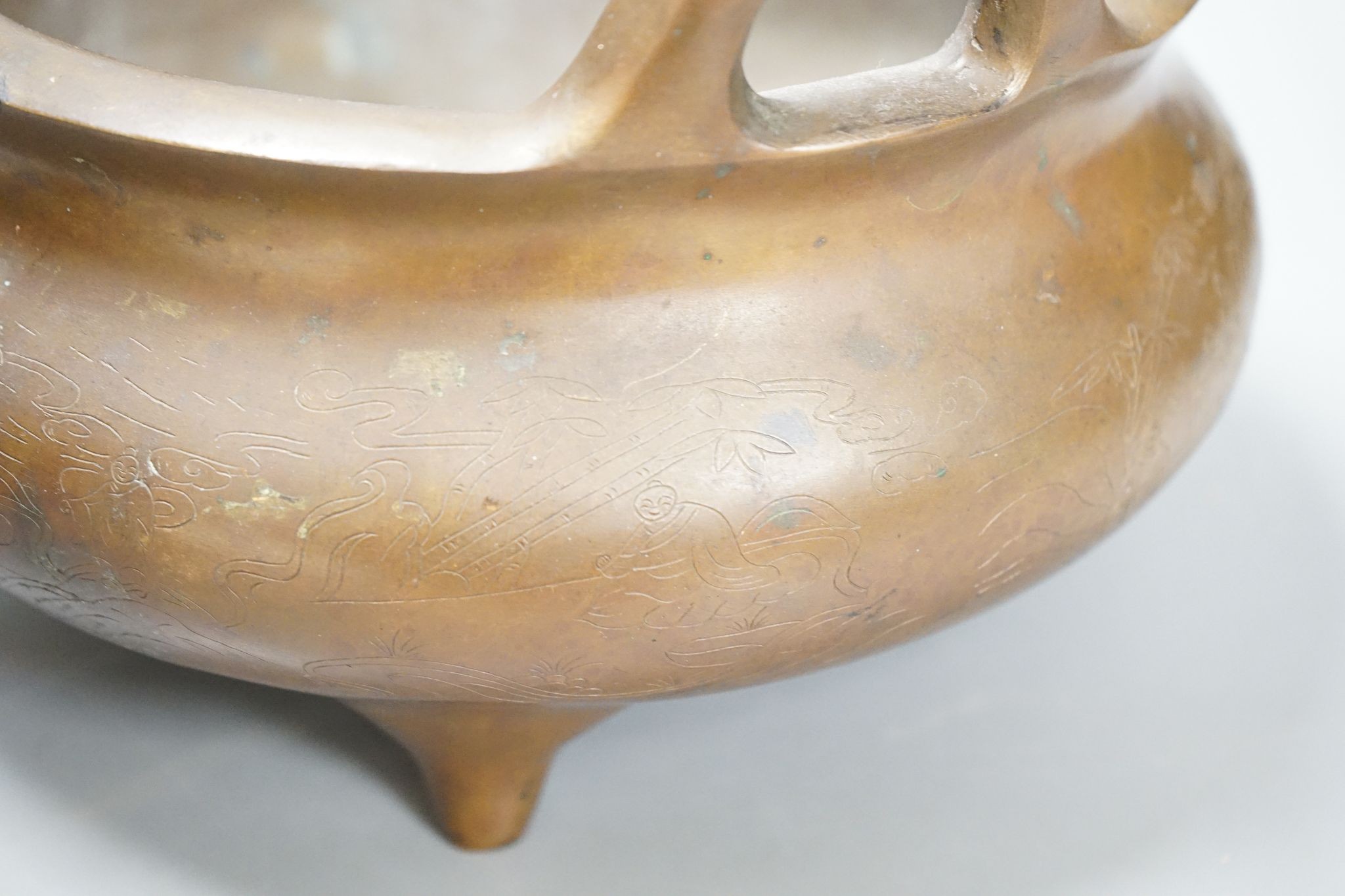 A large Chinese bronze tripod censer, Xuande mark, 24cm handle to handle